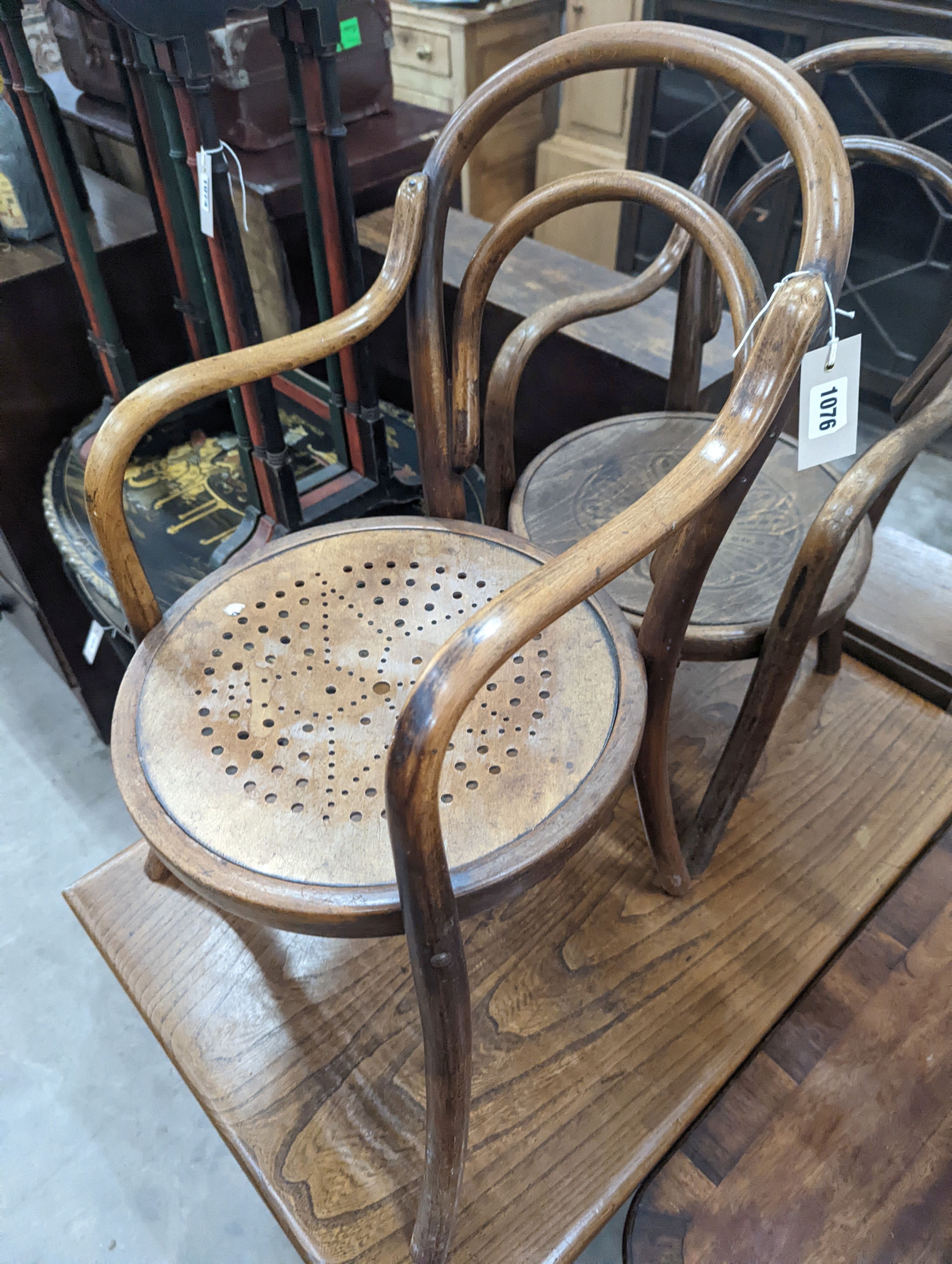 A near pair of early 20th century beech bentwood childs elbow chairs